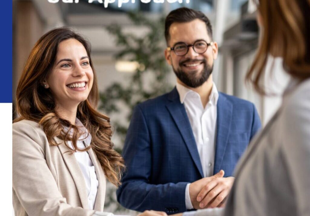 Business professionals smiling and shaking hands