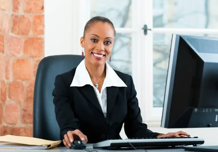 Businesswoman smiling at her desk