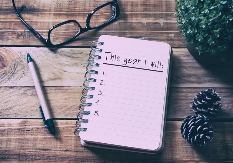 Notebook with New Year resolutions