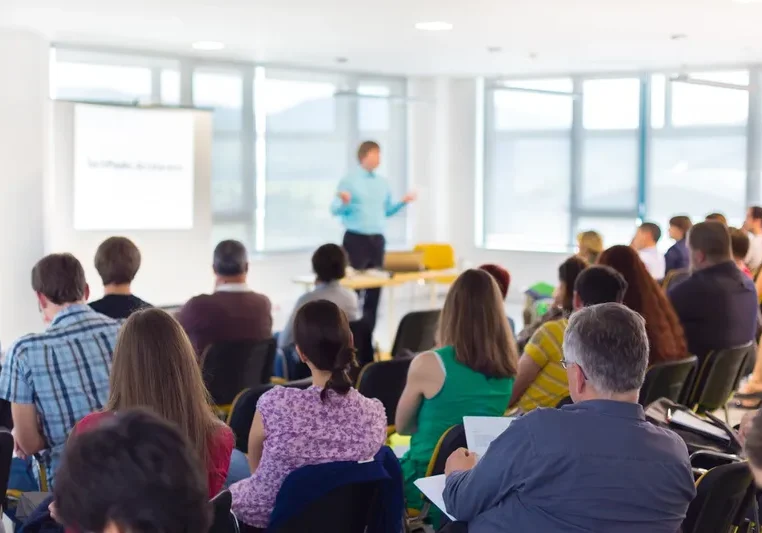 Seminar attendees in a conference room